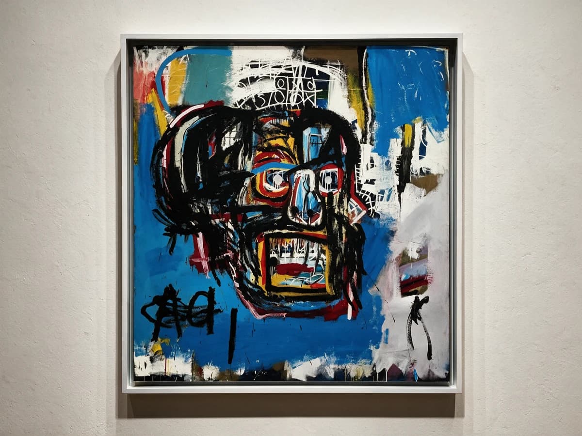 An expressionist portrait in blue, red and black on a gallery wall.